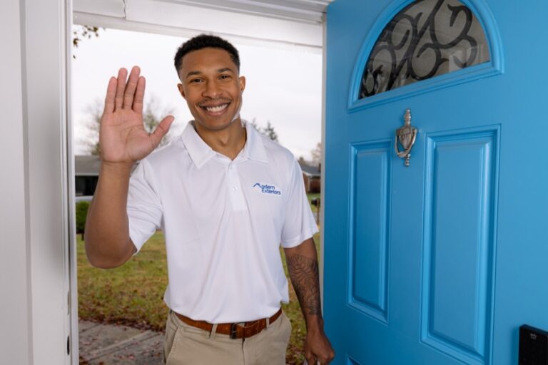 Modern Exteriors team member at a homeowner door for a roofing estimate consultation