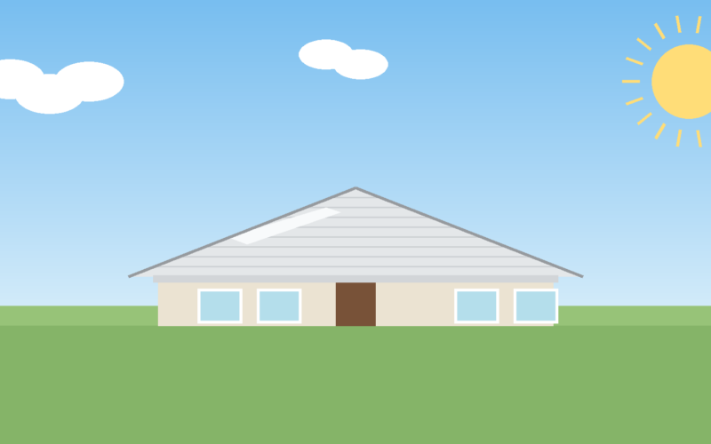 Light-colored reflective asphalt shingle roof on a single-story home under a clear sky