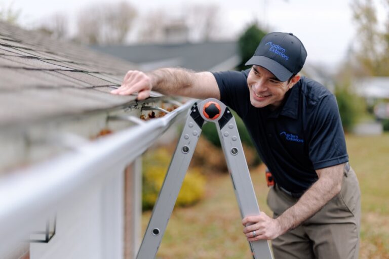 Technician inspecting gutter installation