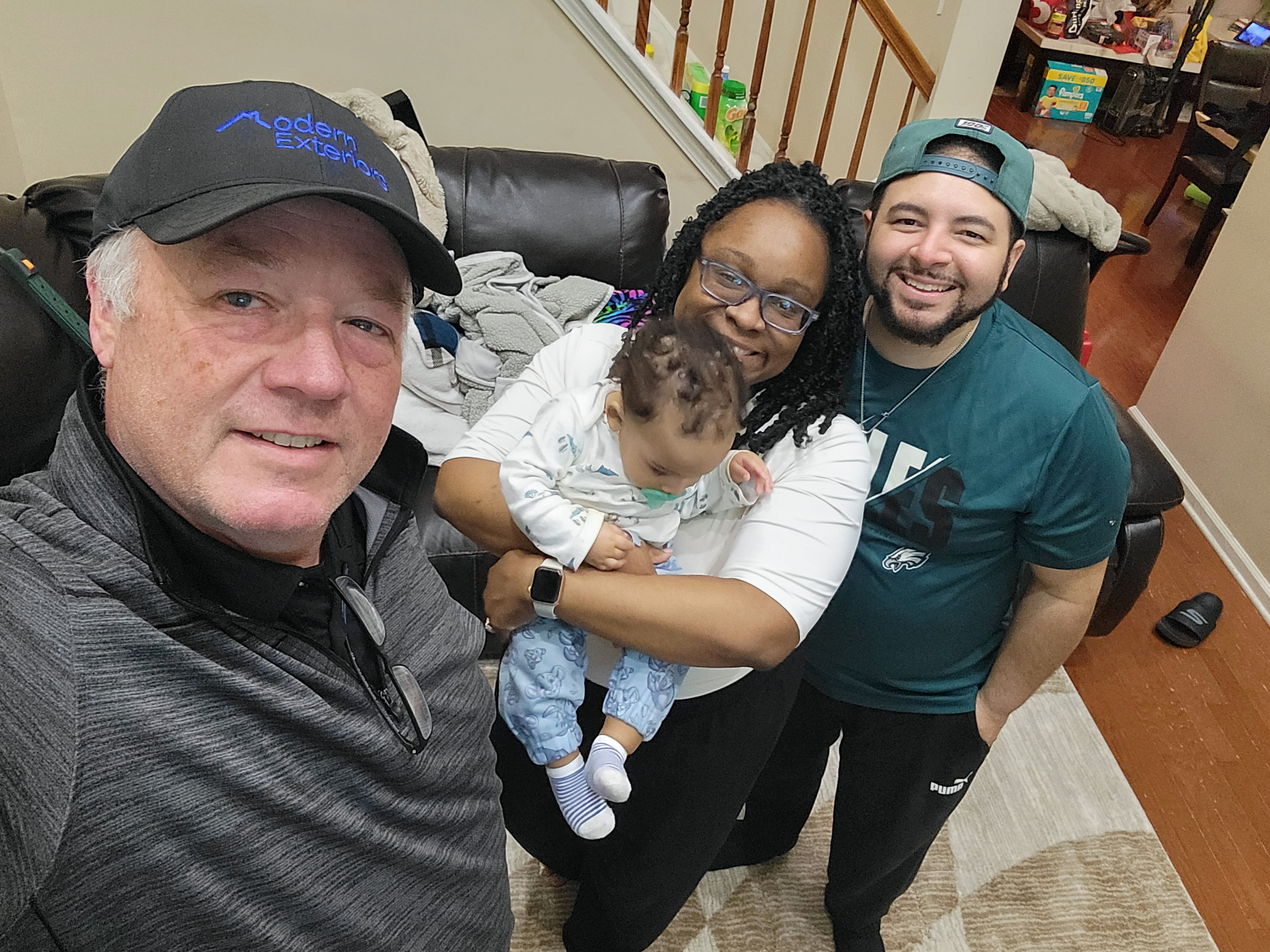 Happy family after roofing project
