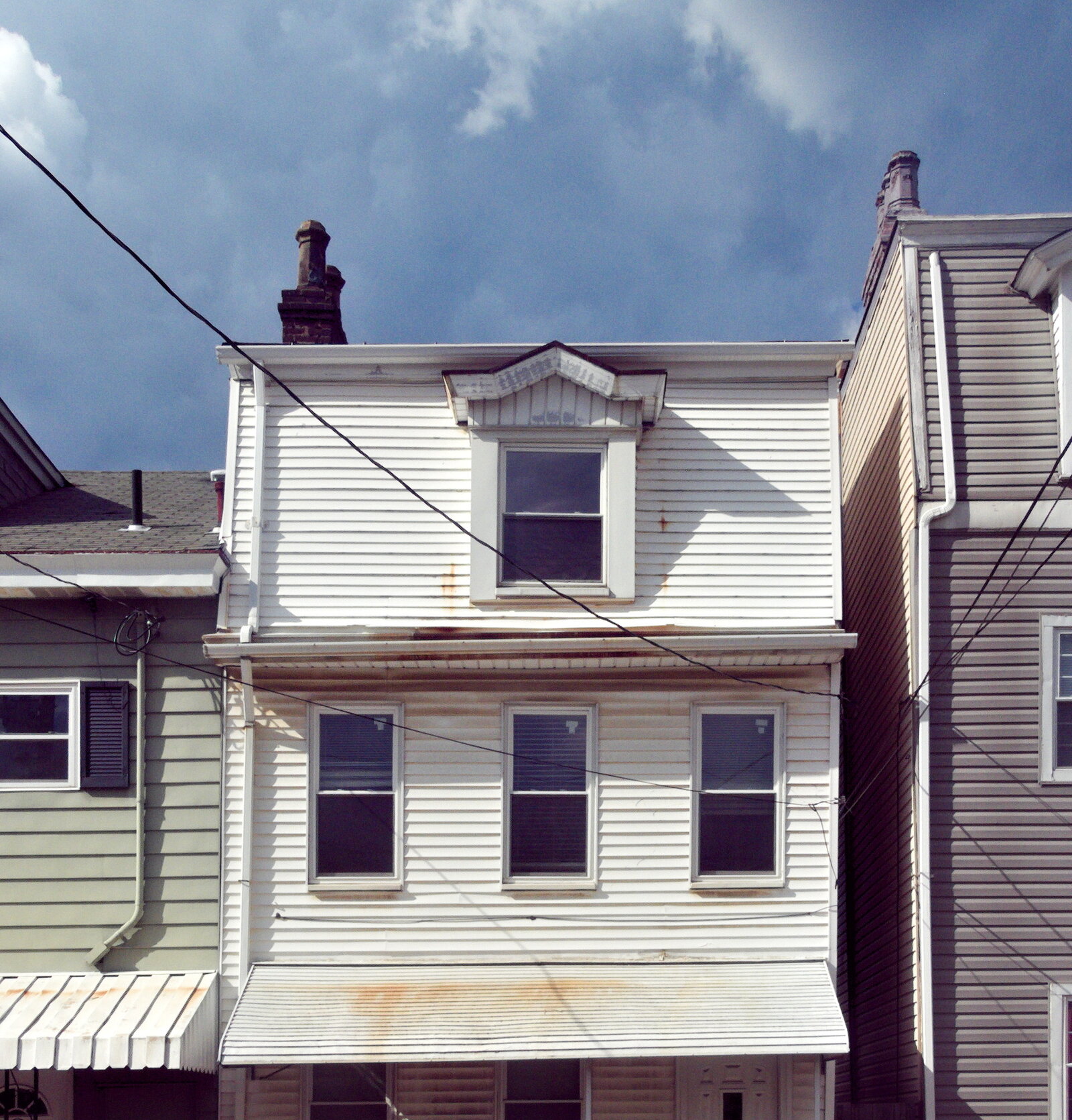 Aluminum siding on a two-story house exterior