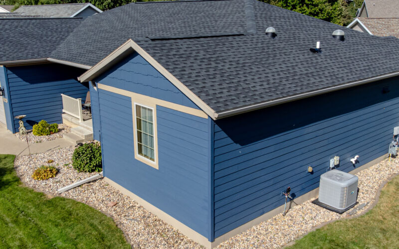 House exterior finished with blue fiber cement lap siding