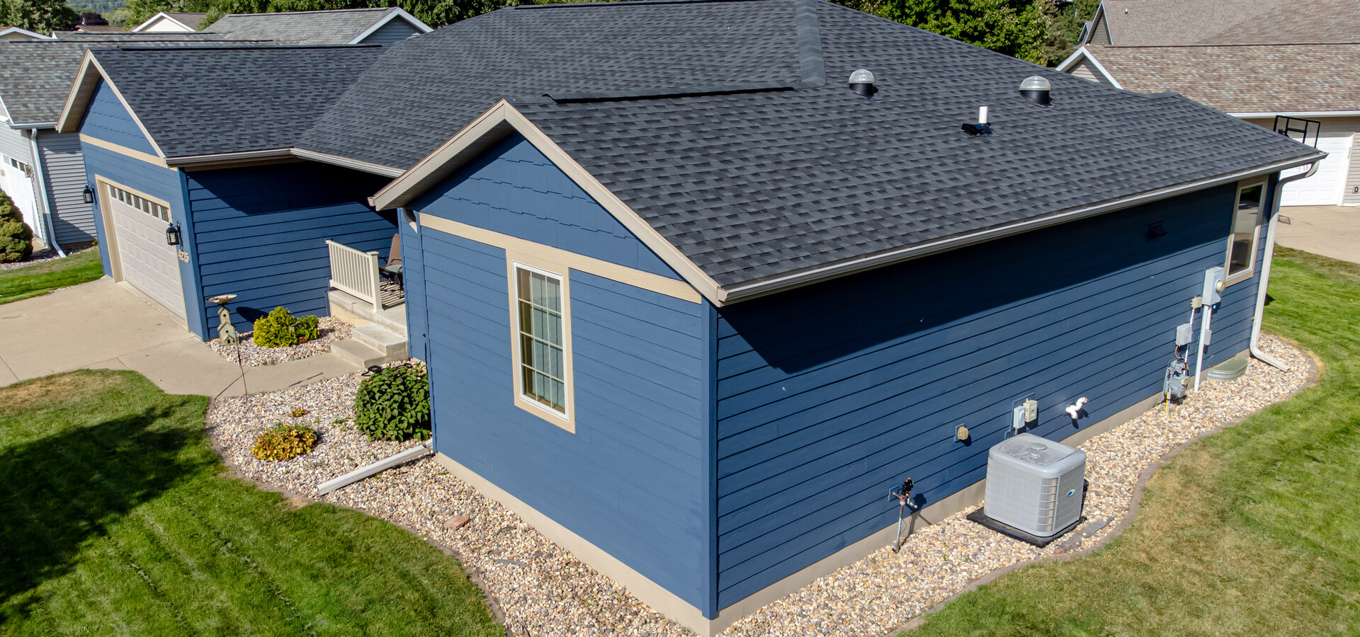 House exterior finished with blue fiber cement lap siding
