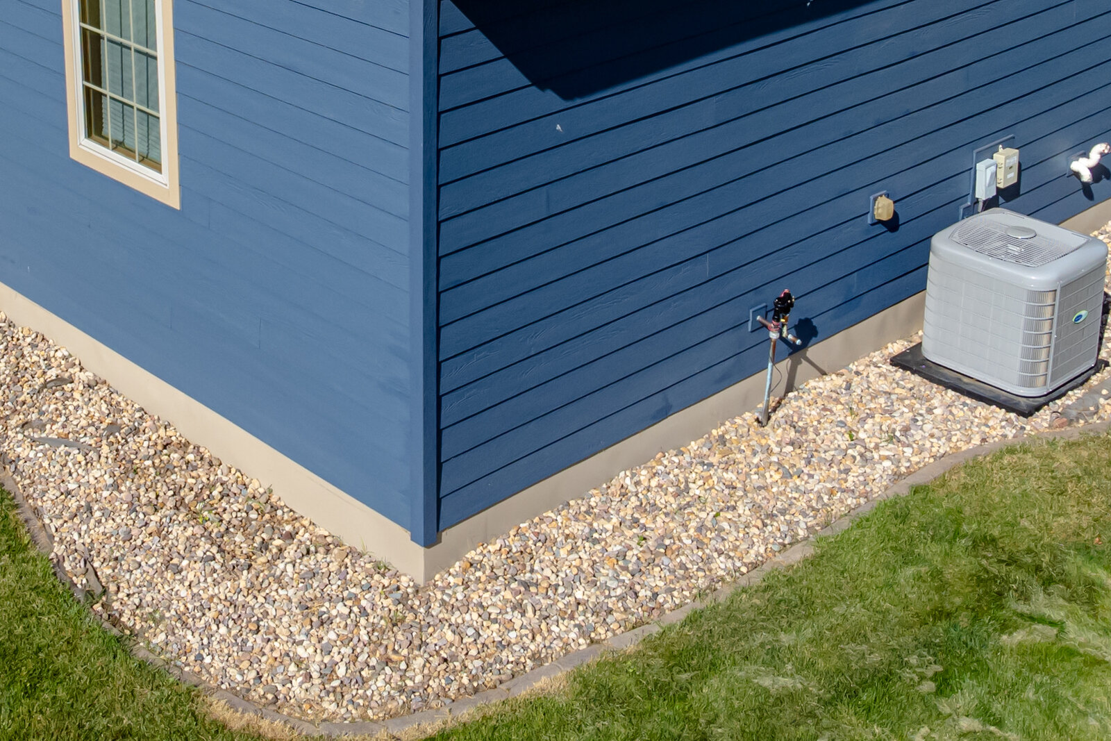 Close-up of fiber cement lap siding on a house exterior corner